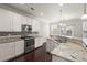 Spacious kitchen with granite countertops, stainless steel appliances, and hardwood floors at 339 Spectrum Rd, Summerville, SC 29486