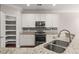 Kitchen boasts granite countertops, stainless steel appliances, and walk-in pantry at 339 Spectrum Rd, Summerville, SC 29486