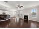 Open living room and kitchen area with hardwood floors and a fireplace at 339 Spectrum Rd, Summerville, SC 29486