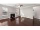 Spacious living room with hardwood floors, fireplace, and ceiling fan at 339 Spectrum Rd, Summerville, SC 29486