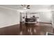 Open living room and kitchen area with hardwood floors and a fireplace at 339 Spectrum Rd, Summerville, SC 29486