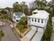 Neighborhood view showcasing a white two-story house with a metal roof at 341 Bridgetown Pass, Mount Pleasant, SC 29464