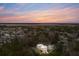 Aerial view of a neighborhood at sunset with a highlighted house at 341 Bridgetown Pass, Mount Pleasant, SC 29464