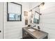 Bathroom with shiplap walls and floating vanity at 341 Bridgetown Pass, Mount Pleasant, SC 29464