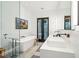 Modern bathroom with double vanity, soaking tub, and glass shower at 341 Bridgetown Pass, Mount Pleasant, SC 29464