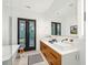 Bright bathroom featuring double sinks and french doors at 341 Bridgetown Pass, Mount Pleasant, SC 29464