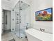 Spa-like bathroom with soaking tub and a glass-enclosed shower at 341 Bridgetown Pass, Mount Pleasant, SC 29464