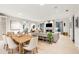 Open concept dining room adjacent to kitchen, features hardwood floors and large windows at 341 Bridgetown Pass, Mount Pleasant, SC 29464