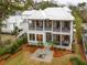 Two-story home with screened porch and a stone patio at 341 Bridgetown Pass, Mount Pleasant, SC 29464