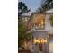 Evening view of two-story home showcasing the front porch and entrance at 341 Bridgetown Pass, Mount Pleasant, SC 29464
