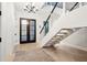 Bright foyer with herringbone floors and modern staircase at 341 Bridgetown Pass, Mount Pleasant, SC 29464