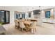Modern kitchen with white cabinets, quartz countertops, and a large island at 341 Bridgetown Pass, Mount Pleasant, SC 29464