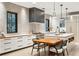 Modern kitchen with white cabinets, wood countertops, and a large island at 341 Bridgetown Pass, Mount Pleasant, SC 29464