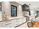 Modern kitchen with white cabinets and geometric backsplash at 341 Bridgetown Pass, Mount Pleasant, SC 29464