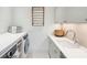Clean laundry room with washer, dryer, and built-in cabinets at 341 Bridgetown Pass, Mount Pleasant, SC 29464