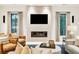 Bright living room with fireplace, TV, and ample natural light at 341 Bridgetown Pass, Mount Pleasant, SC 29464