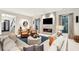 Spacious living room with fireplace, large windows and comfortable seating at 341 Bridgetown Pass, Mount Pleasant, SC 29464