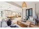 Open living room showcasing kitchen, dining, and seating areas at 341 Bridgetown Pass, Mount Pleasant, SC 29464