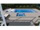 A modern pool design with integrated spa and sleek lounging area at 341 Bridgetown Pass, Mount Pleasant, SC 29464