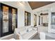 Long porch with white exterior and multiple seating areas, offering a view of the backyard at 341 Bridgetown Pass, Mount Pleasant, SC 29464