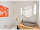Chic powder room with concrete vessel sink, geometric tile, and floating wood shelf at 341 Bridgetown Pass, Mount Pleasant, SC 29464