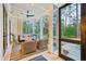 Screened porch features a swing and comfy seating at 341 Bridgetown Pass, Mount Pleasant, SC 29464