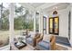 Relaxing screened porch with wicker seating and backyard view at 341 Bridgetown Pass, Mount Pleasant, SC 29464