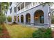 Covered side porch with arched entryway and lighting at 341 Bridgetown Pass, Mount Pleasant, SC 29464