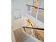 Modern staircase with white risers, dark wood handrail, and metal balusters at 341 Bridgetown Pass, Mount Pleasant, SC 29464
