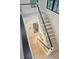 Modern staircase with white risers and dark wood handrail at 341 Bridgetown Pass, Mount Pleasant, SC 29464