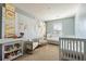 Bedroom with crib, changing table, and comfortable seating at 356 Peters Creek Dr, Summerville, SC 29486