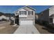 Two-story house with gray siding, white garage door, and landscaping at 356 Peters Creek Dr, Summerville, SC 29486