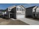 Two-story house with gray siding, white garage door, and driveway at 356 Peters Creek Dr, Summerville, SC 29486