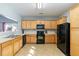 Modern kitchen featuring oak cabinets and black appliances at 356 Peters Creek Dr, Summerville, SC 29486