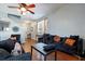 Living room with hardwood floors, black furniture and view of entryway at 356 Peters Creek Dr, Summerville, SC 29486