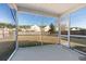 Screened porch overlooking backyard with view of neighborhood at 356 Peters Creek Dr, Summerville, SC 29486