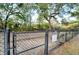 Fenced-in dog park with a bench for pet owners at 415 Parkdale Dr # 2B, Charleston, SC 29414