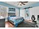 Cozy bedroom with built-in shelving and hardwood floors at 4263 Persimmon Woods Dr, North Charleston, SC 29420