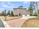 Two-story brick home with a large driveway at 4263 Persimmon Woods Dr, North Charleston, SC 29420