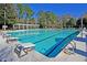 Community pool with diving boards and ample seating at 4263 Persimmon Woods Dr, North Charleston, SC 29420