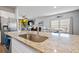 Granite kitchen island with sink and modern faucet at 473 Spanish Wells Rd, Summerville, SC 29486