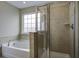Bathroom features a soaking tub and walk-in shower at 484 Whispering Breeze Ln, Summerville, SC 29486