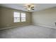 Well-lit bedroom with ceiling fan and neutral carpeting at 484 Whispering Breeze Ln, Summerville, SC 29486