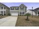 Two-story house with gray siding, black shutters, and a two-car garage at 484 Whispering Breeze Ln, Summerville, SC 29486