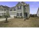 Two-story house with gray siding, black shutters, and a two-car garage at 484 Whispering Breeze Ln, Summerville, SC 29486