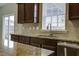 Kitchen features granite countertops, stainless steel sink, and backyard access at 484 Whispering Breeze Ln, Summerville, SC 29486