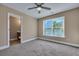Bedroom with neutral walls, carpet flooring, and an ensuite bathroom at 519 Travelers Blvd, Summerville, SC 29485