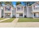 Three-unit townhome building with gray siding and red shutters at 519 Travelers Blvd, Summerville, SC 29485