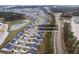 Wide aerial view of neighborhood, highlighting a house with pool at 530 Richfield Way, Summerville, SC 29486