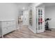 Bright entry hall with hardwood floors, storage, and a view of the living room at 530 Richfield Way, Summerville, SC 29486